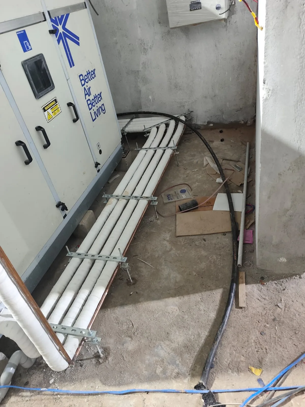 Mechanical-room installation with insulated pipe runs