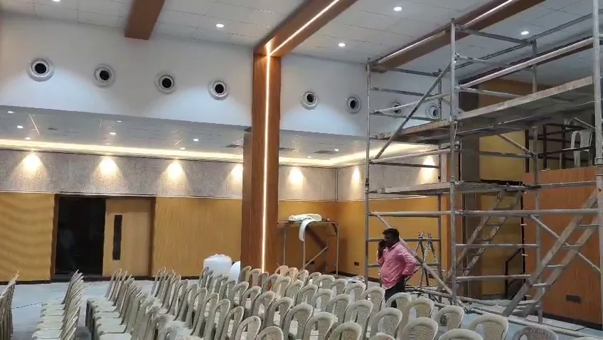 Event venue with wall air outlets and scaffolding, from RK Aircons project footage